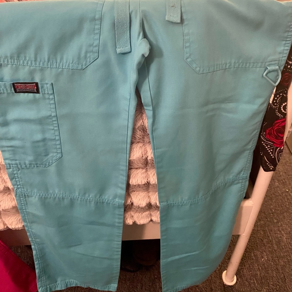 Turquoise scrubs bottoms.